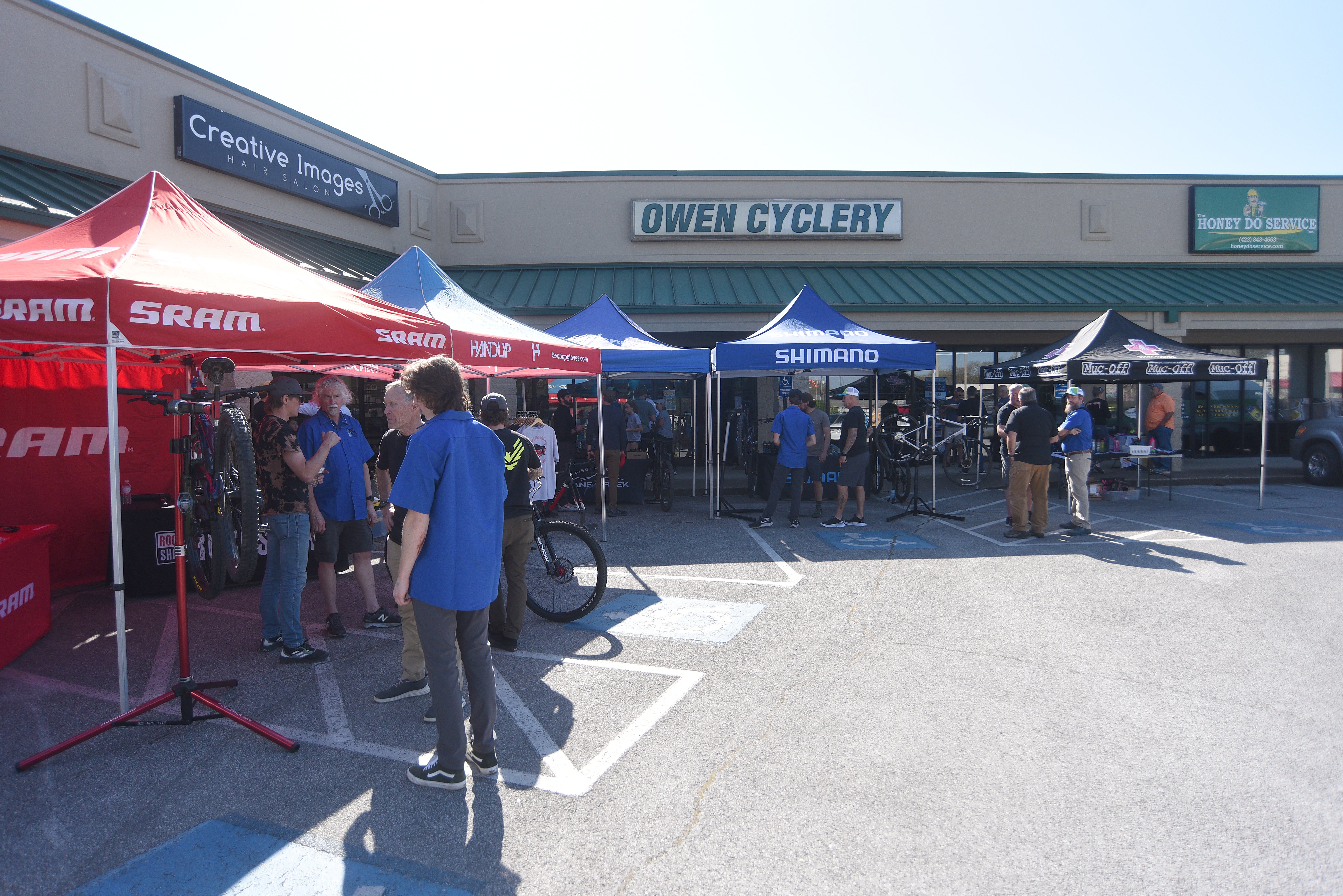 Staff photo by Matt Hamilton / Vendors operate booths outside the store during the 50 year celebration for Owen Cyclery in Hixson. on Thursday, March 30, 2023.