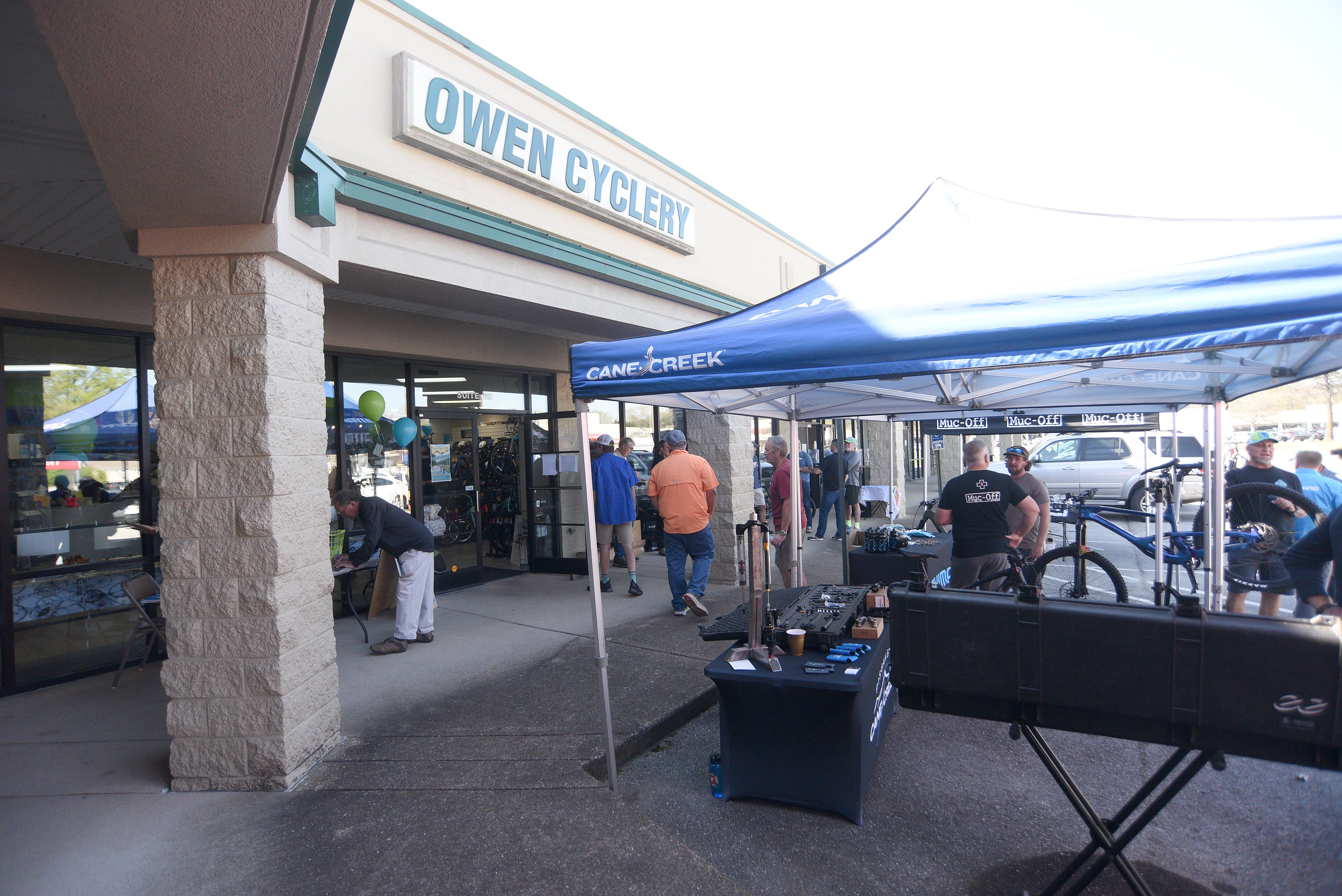 Staff photo by Matt Hamilton / Vendors operate booths outside the store during the 50 year celebration for Owen Cyclery in Hixson. on Thursday, March 30, 2023.