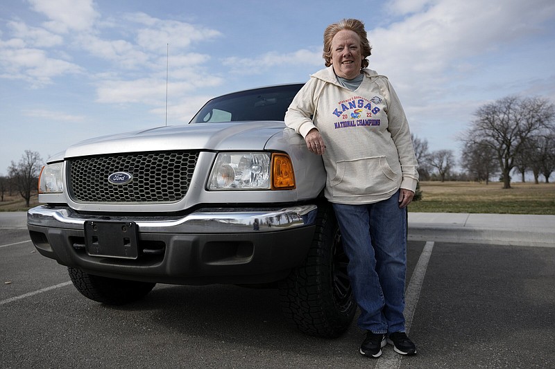 Carol Rice stands with her recently-purchased 2003 Ford Ranger in Shawnee, Kan. Rice’s timing to buy the truck was ideal, taking advantage of a recent dip in used-car prices which now appear to be heading back up.
(AP/Charlie Riedel)