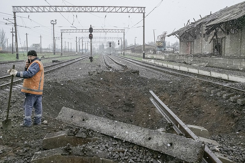 Workers clean up debris from a Russian attack Thursday at a train station in Druzhkivka in eastern Ukraine.
(The New York Times/Mauricio Lima)