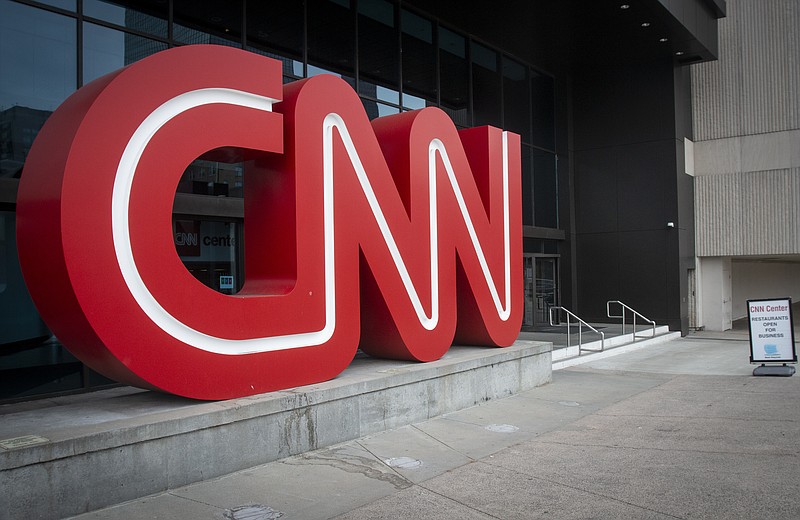 FILE - The CNN logo is displayed at the entrance to the CNN Center in Atlanta on Feb. 2, 2022. (AP Photo/Ron Harris, File)