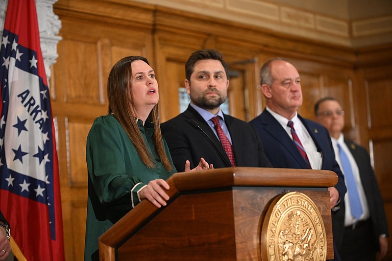 Gov. Sarah Huckabee Sanders, Sen. Jonathan Dismang and Sen. Jimmy Hickey announce the income and corporate tax cuts Thursday at the state Capitol.
(Arkansas Democrat-Gazette/Staci Vandagriff)