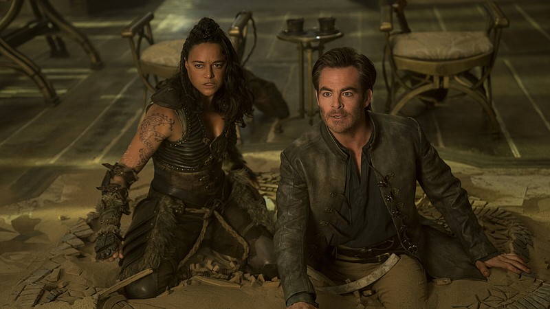 Charming thief Edgin (Chris Pine) and the barbarian Holga (Michelle Rodriguez) lead a merry band of unlikely adventurers who embark on an epic quest to retrieve a lost relic in “Dungeons & Dragons: Honor Among Thieves.”