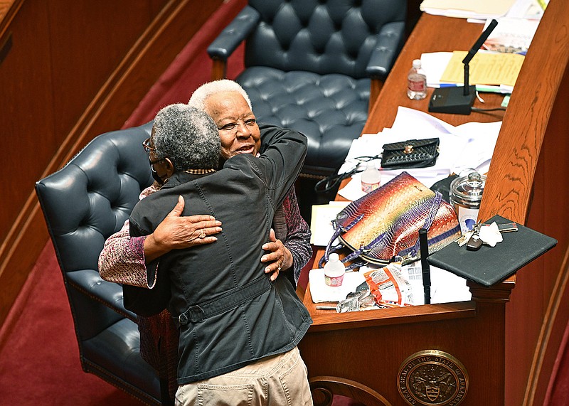 Former Democratic Sen. Irma Hunter Brown (right) of Little Rock hugs Sen. Stephanie Flowers, D-Pine Bluff, while Brown is honored for her service to the state during the Senate session Thursday at the state Capitol in Little Rock.
(Arkansas Democrat-Gazette/Staci Vandagriff)