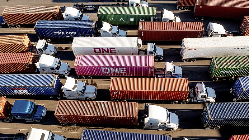 FILE - Trucks line up to enter a Port of Oakland shipping terminal on Nov. 10, 2021, in Oakland, Calif. (AP Photo/Noah Berger, File)