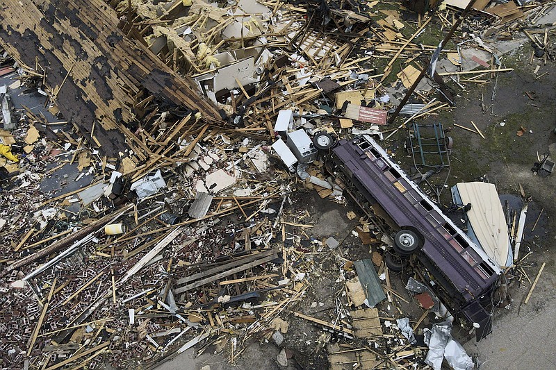 FILE - Debris is strewn about tornado-damaged homes March 26, 2023, in Rolling Fork, Miss. (AP Photo/Julio Cortez, File)