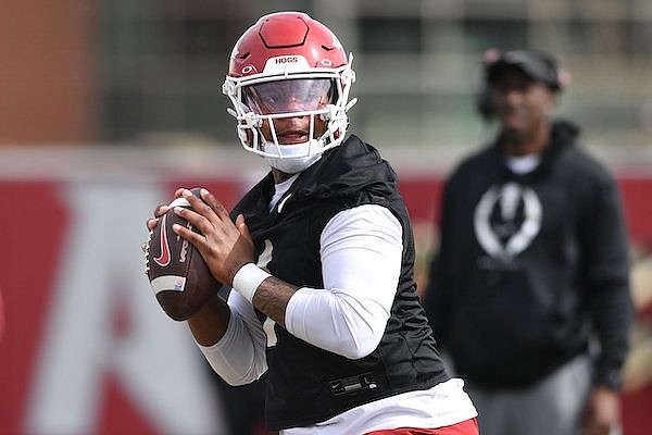 Arkansas quarterback KJ Jefferson throws Thursday, March 30, 2023, during practice at the university practice facility in Fayetteville.