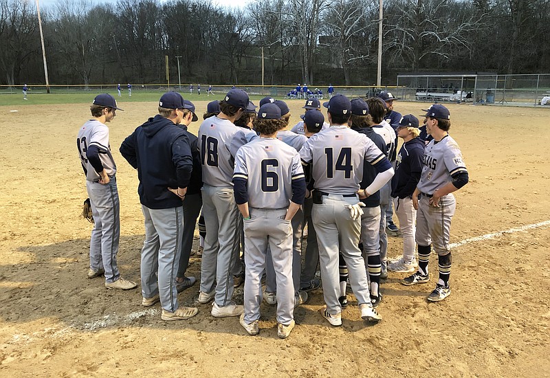 The Helias Crusaders meet after Thursday's 5-3 win against the Fatima Comets at Lions Field in Westphalia. (Tom Rackers/News Tribune)