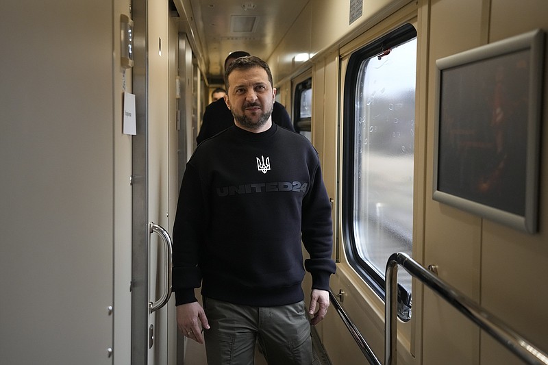 Ukrainian President Volodymyr Zelenskyy arrives for an interview with The Associated Press on a train traveling from the Sumy region to Kyiv, Ukraine, Tuesday March 28, 2023. A team of journalists from The Associated Press traveled with Zelenskyy aboard his train for two nights as he visited troops along the front lines and communities that have been liberated from Russian control. Zelenskyy is hoping his trips keep the public's attention on the war, particularly in parts of Ukraine where life can often appear to have returned to normal. (AP Photo/Efrem Lukatsky)