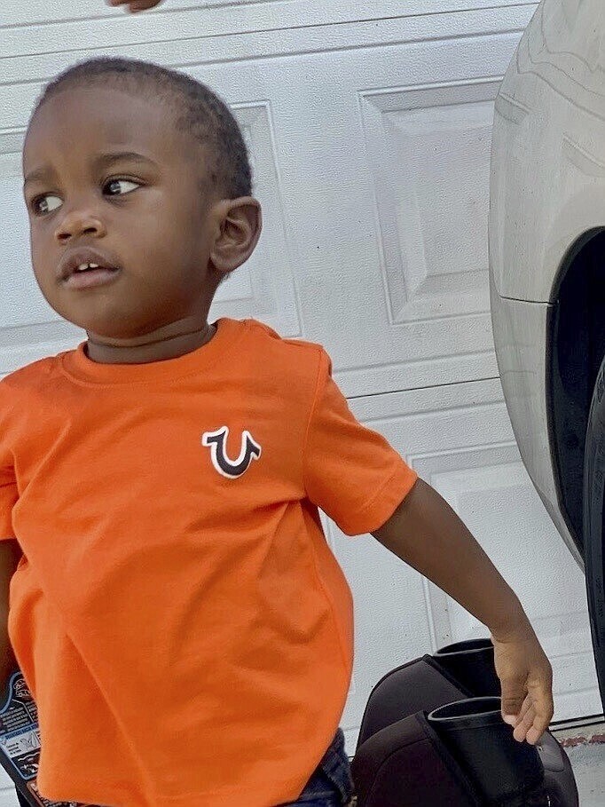 This photo provided by the St. Petersburg, Fla., Police Department shows 2-year-old Taylen Mosley, who is missing. Searchers combed the area around a Florida apartment complex on Friday, March 31, 2023, for the missing 2-year-old boy whose mother was found slain in their apartment, police said. St. Petersburg Police Chief Anthony Holloway said the boy's father, 21-year-old Thomas Mosley, is considered a “person of interest” in the killing of the mother, 20-year-old Pashun Jeffery. (St. Petersburg Police Department via AP)