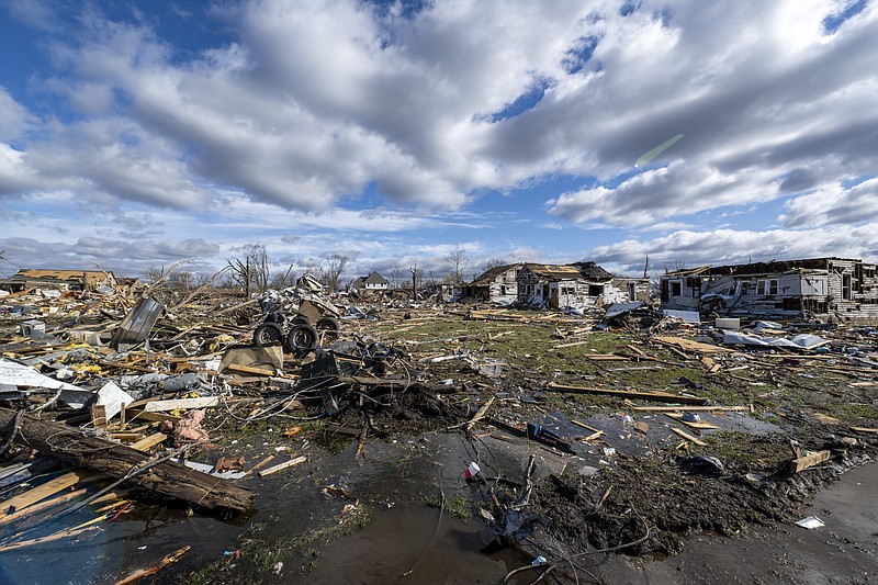 Damage from a late-night tornado is seen in Sullivan, Ind., Saturday, April 1, 2023. Multiple deaths were reported in the area following the storm. (AP Photo/Doug McSchooler)