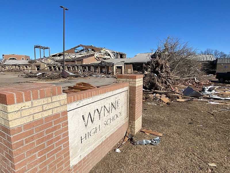 Wynne High School sign in front of school buildings damaged when a tornado swept through the community on Friday, March 31, 2023 (Arkansas Democrat-Gazette/Staci Vandagriff)
