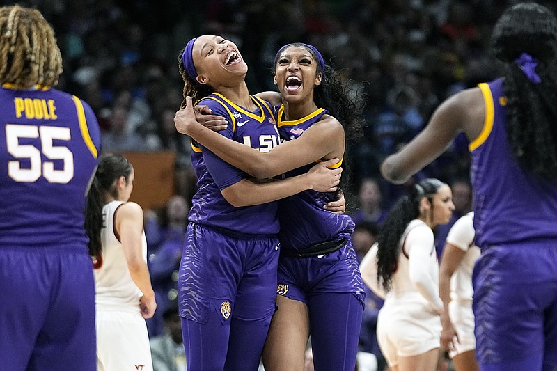 LSU's Angel Reese and LaDazhia Williams celebrate during the second half of Friday night's national semifinal game in the NCAA Tournament against Virginia Tech in Dallas. (Associated Press)
