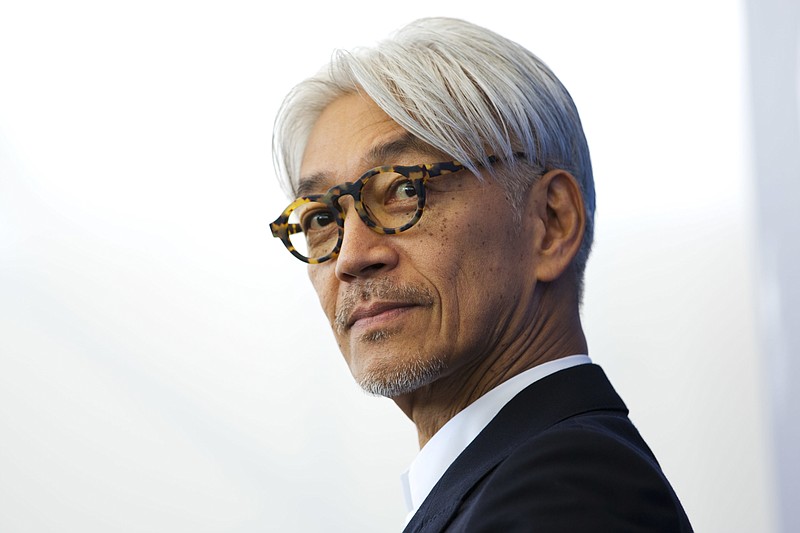 FILE - Maestro Ryuichi Sakamoto poses during a photo call for the film "Coda" at the 74th Venice Film Festival in Venice, Italy, Sept. 3, 2017. Japan's recording company Avex says Sakamoto, a musician who scored for Hollywood movies such as “The Last Emperor” and “The Revenant,” has died. He was 71. He died March 28, according to the statement released Sunday, April 2, 2023. (AP Photo/Domenico Stinellis, File)