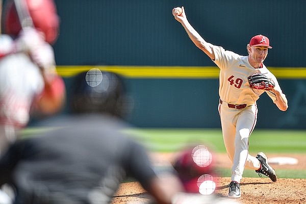 Arkansas pitcher Cody Adcock throws during a game against Alabama on Sunday, April 2, 2023, in Fayetteville.