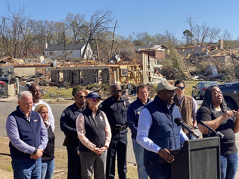 Mayor Frank Scott Jr. holds a press conference with FEMA Administrator Dianne Criswell (center left) on Sunday, April 2, 2023 behind the Colony West Shopping Center in Little Rock. (Arkansas Democrat-Gazette/Staci Vandagriff)