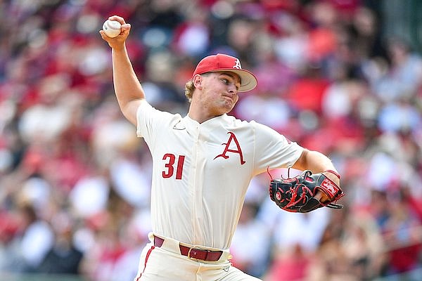 Arkansas pitcher Dylan Carter throws during a game against Alabama on Sunday, April 2, 2023, in Fayetteville.