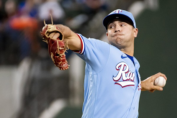 Texas Rangers manager Bruce Bochy, second from right, takes the ball from Texas  Rangers starting pitcher Martin Perez, second from left, in the top of the  sixth inning in a baseball game