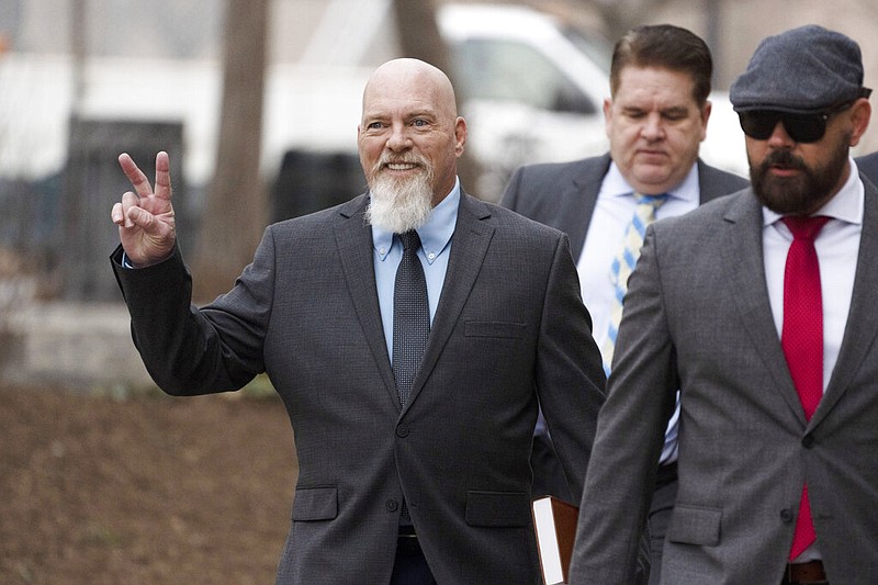 Richard "Bigo" Barnett (left) of Gravette and two of his attorneys, Bradford L. Geyer (center) of Cinnaminson, N.J., and Joseph McBride of New York City, are shown arriving at federal court in Washington in this Jan. 10, 2023 file photo. McBride and another attorney, Carolyn Stewart of Plant City, Fla., were allowed to withdraw as Barnett's attorneys of record on Thursday, April 6, 2023. Geyer will stay on to shepherd Barnett through his sentencing phase, as will attorney Jonathan Gross of Baltimore. (AP/Manuel Balce Ceneta)