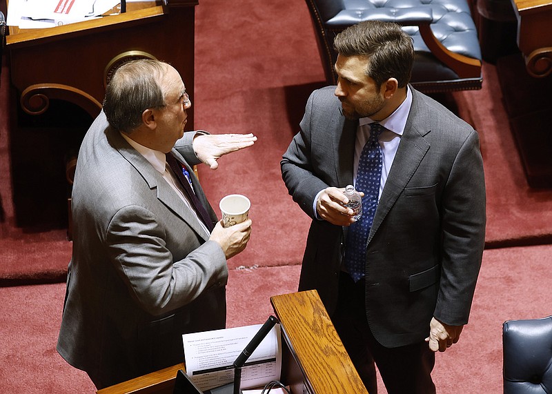 Sen. Mark Johnson, R-Little Rock, talks with Sen. Jonathan Dismang before the Senate session on Thursday. Dismang, co-chairman of the Joint Budget Committee, said that with inflation about 8%, the proposed Revenue Stabilization Act would authorize a very conservative general revenue budget that would increase about 2.95% in fiscal 2024.
(Arkansas Democrat-Gazette/Thomas Metthe)