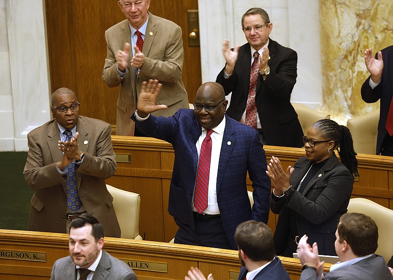 Rep. Fred Allen (center), D-Little Rock, is honored by fellow House members during the House session on Thursday at the state Capitol in Little Rock. Allen is being inducted into the Arkansas Sports Hall of Fame next week.
(Arkansas Democrat-Gazette/Thomas Metthe)