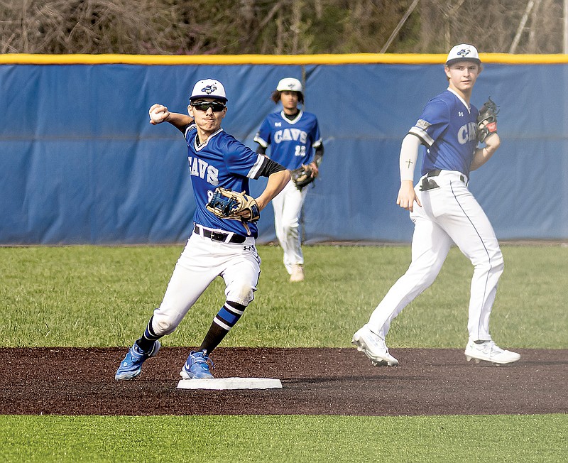 Capital City's Luke Skinner steps on second base as he throws to first to complete a double play during Friday afternoon’s game against Rolla in the Jays Baseball Classic at Capital City High School. (Josh Cobb/News Tribune)