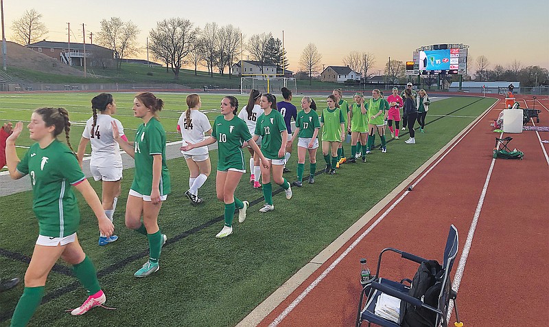 The Jefferson City Lady Jays and Blair Oaks Lady Falcons shake hands after Friday night's action at the Falcon Athletic Complex in Wardsville. (Tom Rackers/News Tribune)