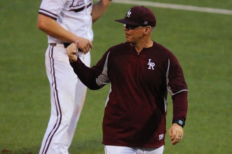 UALR head coach Chris Curry gives instruction to his players after a visit to the mound in the top of the fifth inning of the Trojans' game against South Alabama on Friday, May 4, 2018, at Gary Hogan Field in Little Rock.