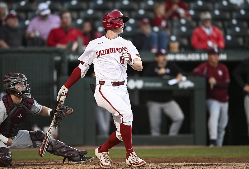 Arkansas outfielder Jace Bohrofen (8) contacts the ball, Tuesday, April 11, 2023 during the first inning of a baseball game at Baum-Walker Stadium in Fayetteville. Visit nwaonline.com/photos for today's photo gallery...(NWA Democrat-Gazette/Charlie Kaijo)