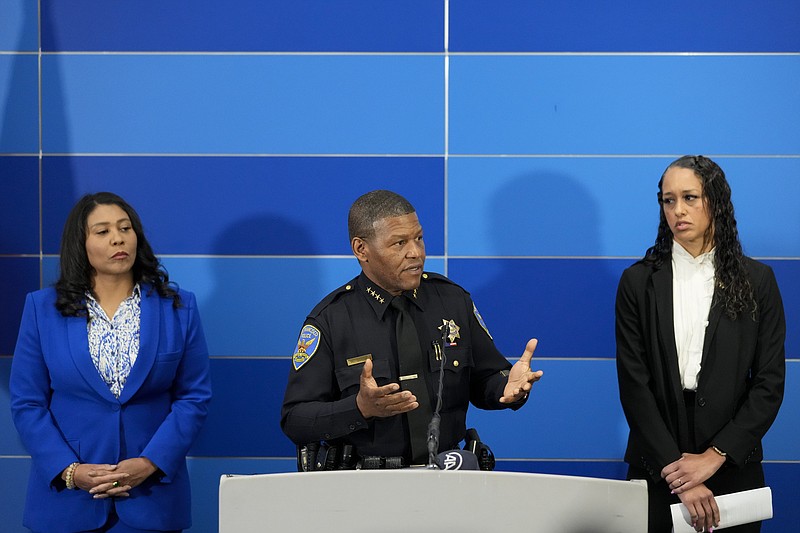 San Francisco Police chief William Scott provides an update on the homicide investigation of Robert Lee during a press conference where officials announced the arrest of a suspect, Thursday, April 13, 2023, in San Francisco. San Francisco mayor London Breed, left, and city District Attorney Brooke Jenkins listen. (AP Photo/Godofredo A. Vásquez)