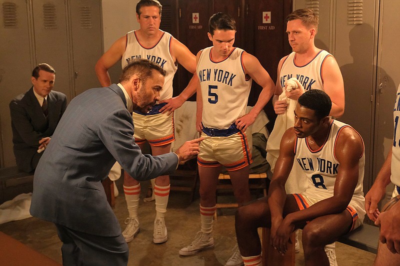 Famously anxious New York Knicks coach Joe Lapchick (Jeremy Piven) instructs the NBA’s second Black player, Arkansas native Nate “Sweetwater” Clifton (Everett Osborne), as his teammates look on in the sports film “Sweetwater.”