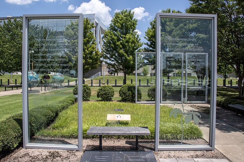 Five 10-foot-tall etched glass panels are shown on the grounds of the Clinton Presidential Center in Little Rock in this July 6, 2022 file photo. The panels previously accompanied the Anne Frank tree, a sapling that was taken from a chestnut tree that once stood outside the house where Anne Frank and her family hid from the Nazis during World War II. The sapling did not survive in Arkansas' climate. (Arkansas Democrat-Gazette/Cary Jenkins)