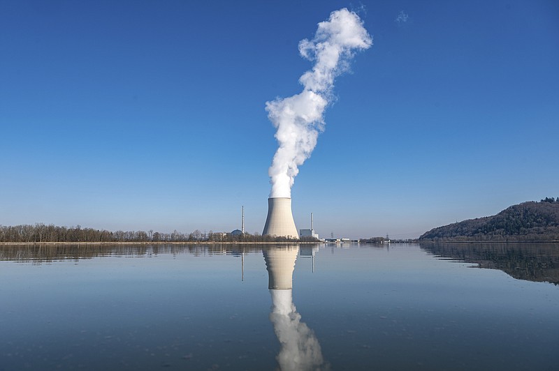 FILE - Water vapor rises from the nuclear power plant Isar II in Essenbach, Germany, March 3, 2022. Germany is shutting down this nuclear power plant and two others on Saturday, April, 2023, as part of an energy transition agreed by successive governments. (Armin Weigel/dpa via AP, File)
