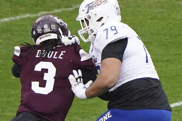 Tulsa offensive lineman Jaden Muskrat (79) blocks Mississippi State linebacker Aaron Brule (3) during the first half of the Armed Forces Bowl NCAA college football game Thursday, Dec. 31, 2020, in Fort Worth, Texas. (AP Photo/Jim Cowsert)