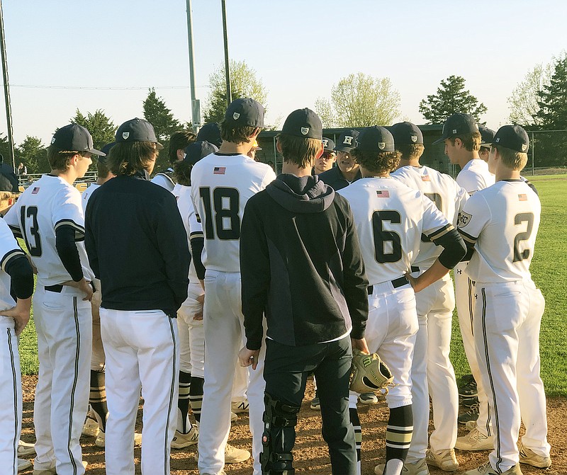 Helias coach Chris Wyrick talks to the Crusaders after their 5-3 win Monday against the Eldon Mustangs at the American Legion Post 5 Sports Complex. (Tom Rackers/News Tribune)