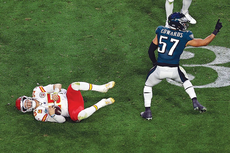 In this Feb. 12 file photo, Chiefs quarterback Patrick Mahomes reacts after being tackled by Eagles linebacker T.J. Edwards during Super Bowl 57 in Glendale, Ariz. (Associated Press)
