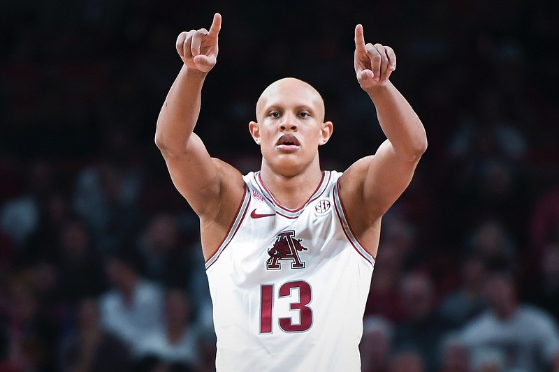 Arkansas guard/forward Jordan Walsh (13) gestures, Tuesday, February 21, 2023 during the second half of a basketball game at Bud Walton Arena in Fayetteville. Visit nwaonline.com/photos for the photo gallery.