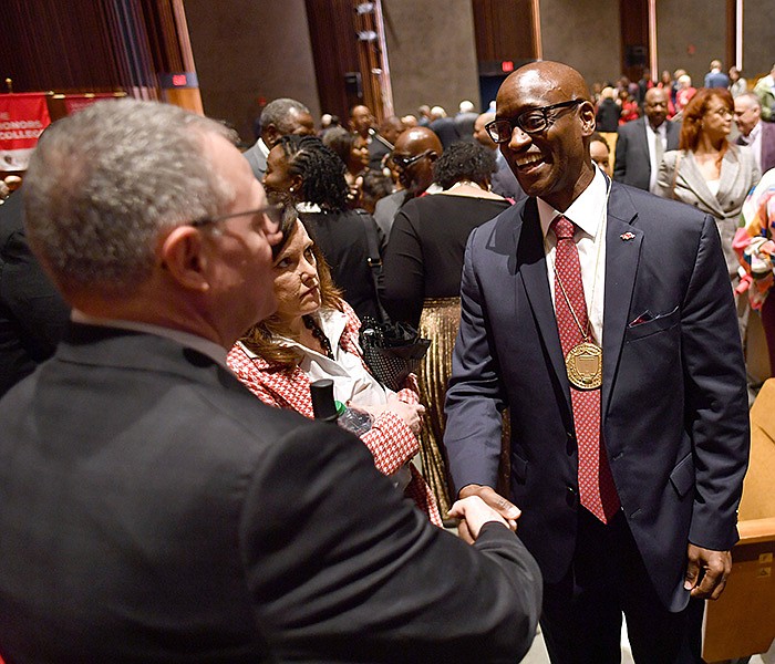 Charles Robinson, chancellor of the University of Arkansas, is congratulated Thursday by members of the campus community after Robinson’s formal investiture as chancellor inside the Jim and Joyce Faulkner Performing Arts Center on the university campus in Fayetteville. More photos at arkansasonline.com/421chancellor/.
(NWA Democrat-Gazette/Andy Shupe)