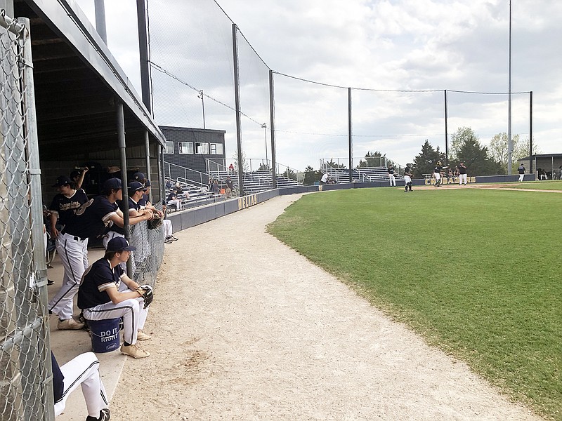 The Helias Crusaders watch as the Rock Bridge Bruins prepare on the field prior to Wednesday's game at the American Legion Post 5 Sports Complex. (Tom Rackers/News Tribune)