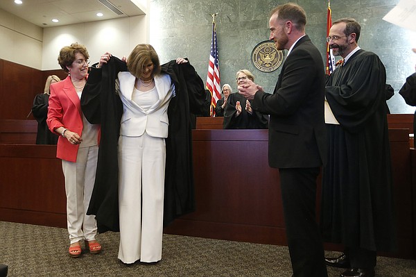 Amid laughter and accolades, Ervin installed during investiture ceremony