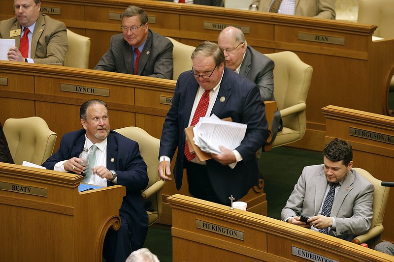 Arkansas state Rep. Lane Jean, R-Magnolia, heads to the well of the House in the state Capitol in Little Rock to present budget bills in this April 6, 2023 file photo. (Arkansas Democrat-Gazette/Thomas Metthe)