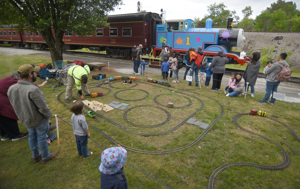 Staff photo by Matt Hamilton / Visitors watch model versions of Thomas the Tank Engine as the life-size Thomas rolls by during the Day Out With Thomas at the Tennessee Valley Railroad Museum on Sunday, April 23, 2023.