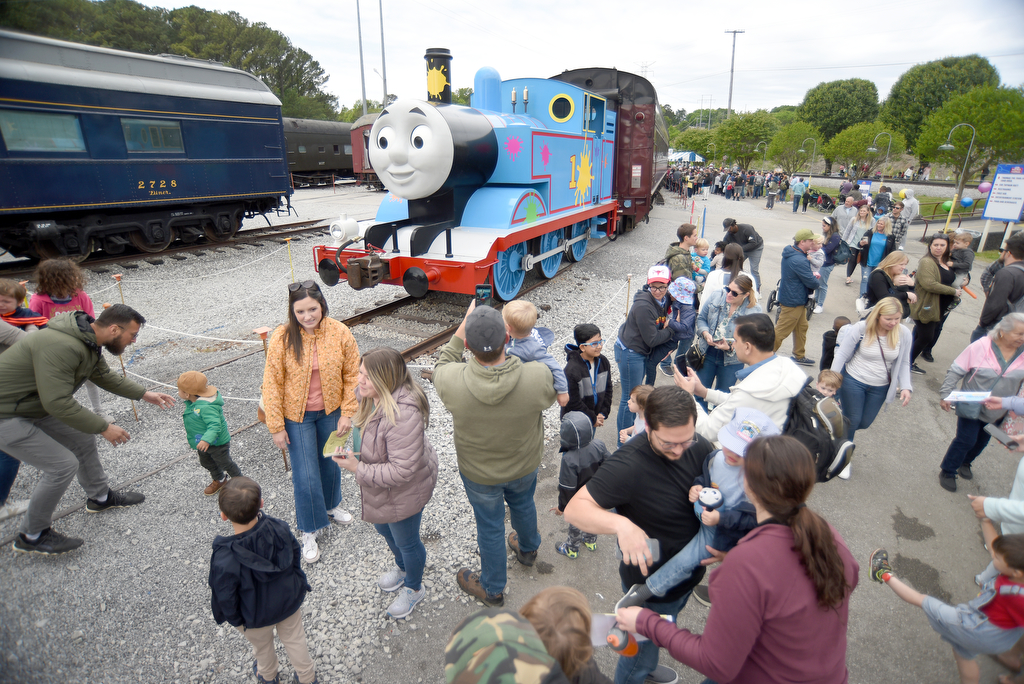 Staff photo by Matt Hamilton / Visitors take pictures of the life-size Thomas the Tank Engine during the Day Out With Thomas at the Tennessee Valley Railroad Museum on Sunday, April 23, 2023.