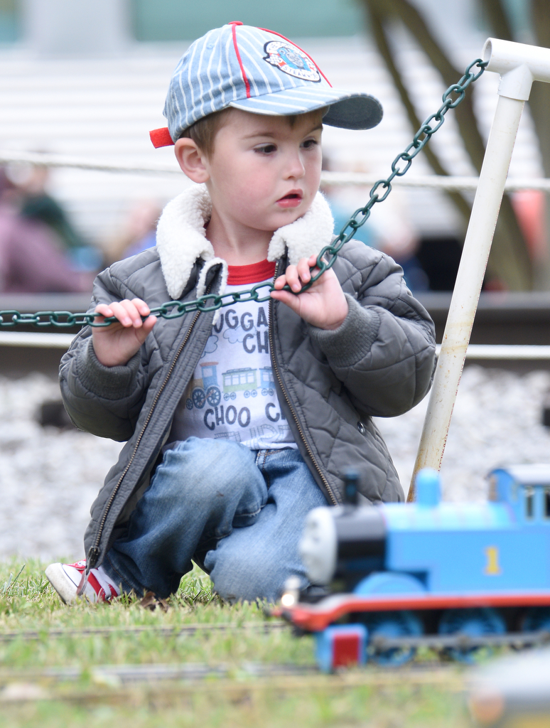 Staff photo by Matt Hamilton /  Pikeville resident Carson Monday, 3, watches a model version of Thomas the Tank Engine during the Day Out With Thomas at the Tennessee Valley Railroad Museum on Sunday, April 23, 2023.