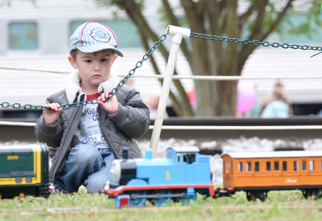 Staff photo by Matt Hamilton /  Pikeville resident Carson Monday, 3, watches a model version of Thomas the Tank Engine during the Day Out With Thomas at the Tennessee Valley Railroad Museum on Sunday, April 23, 2023.