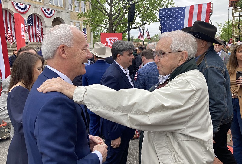 Former Arkansas governor Asa Hutchinson is greeted by well wishers Wednesday, April 26, 2023 at his campaign for president formal announcement at the Bentonville Square. (NWA Democrat-Gazette/FLIP PUTTHOFF)