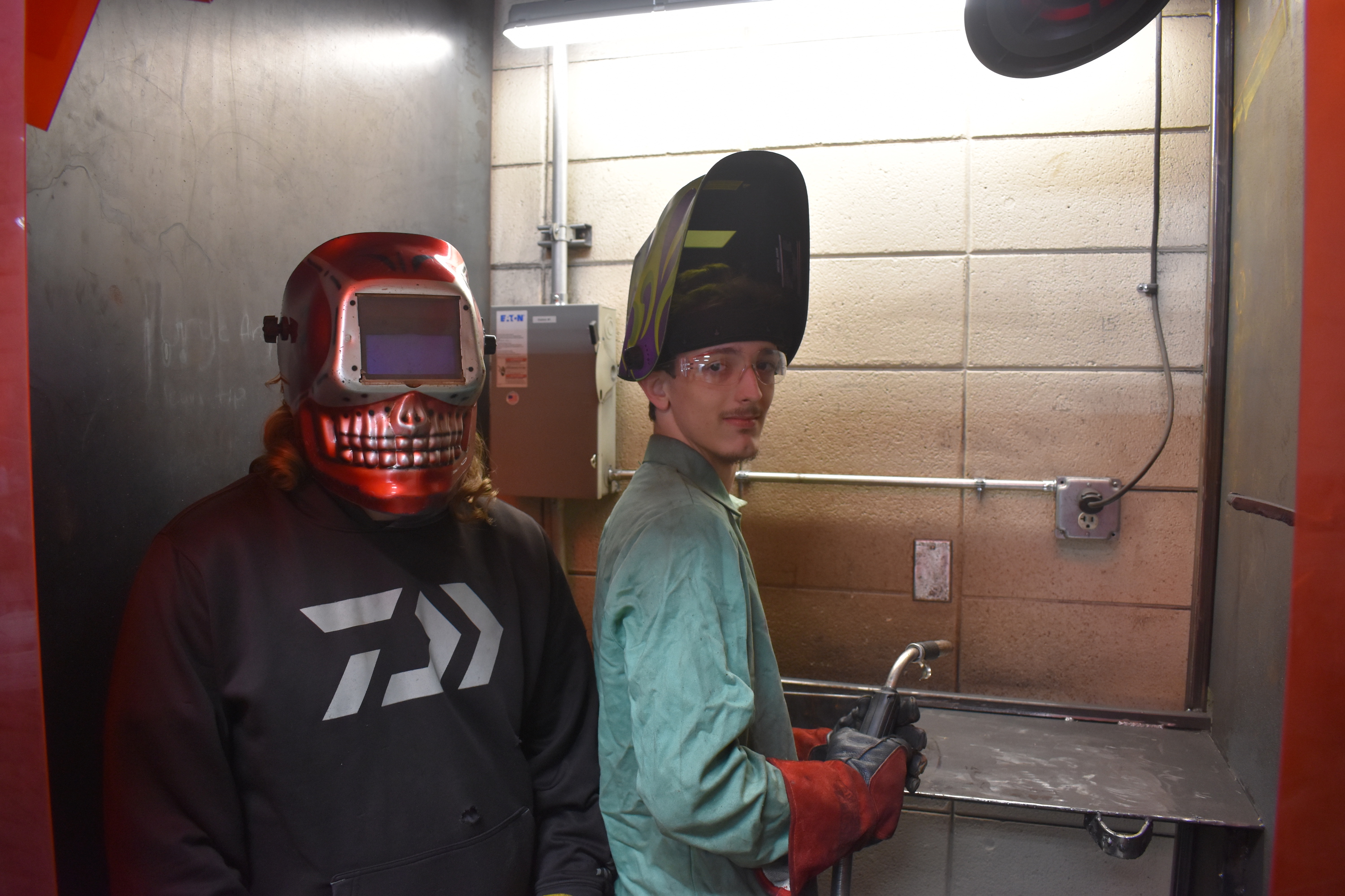 Staff Photo by Andrew Wilkins / A student in the Walker County school district's Launch program, Jacob Broome, gives a welding demonstration while fellow student Jonathan Bullard observes Thursday.