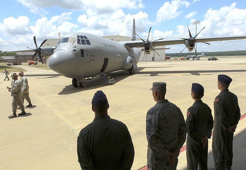 A welcoming party waits as a brand-new C-130J arrives at Little Rock Air Force Base in this June 20, 2016 file photo. The plane replaced the last remaining non-J model of the C-130s in the 41st Airlift Squadron at the base. (Arkansas Democrat-Gazette file photo)