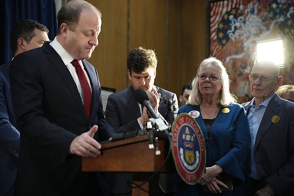 Colorados governor signs 4 guncontrol bills into law Colorados governor signs 4 guncontrol bills into law