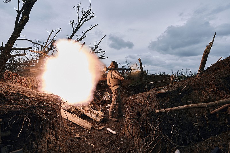 A Ukrainian soldier fires an RPG toward Russian positions Friday on the front line near Avdiivka in the Donetsk region of eastern Ukraine.
(AP/Libkos)